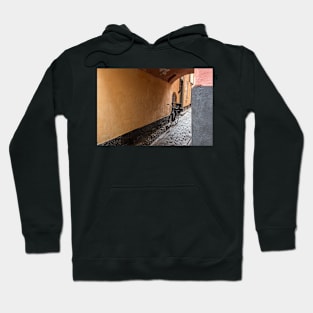 in a narrow alley you see a bike Hoodie